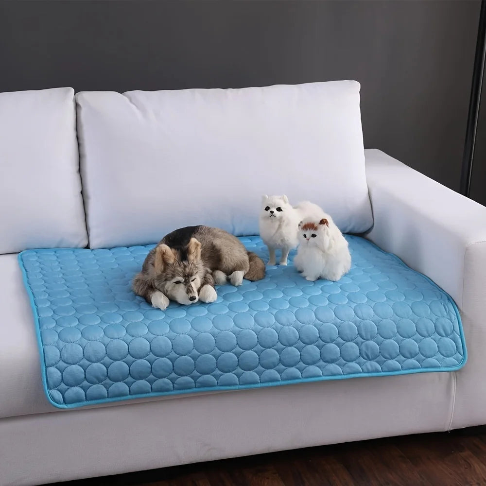 Cool-Touch Pet Mat in Blue — dogs and cats resting on the mat on a white sofa