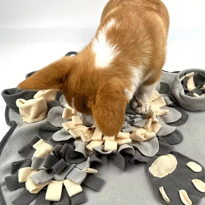 Forage Snuffle Mat in Stone — a dog sniffing out treats hidden in the fabric petals