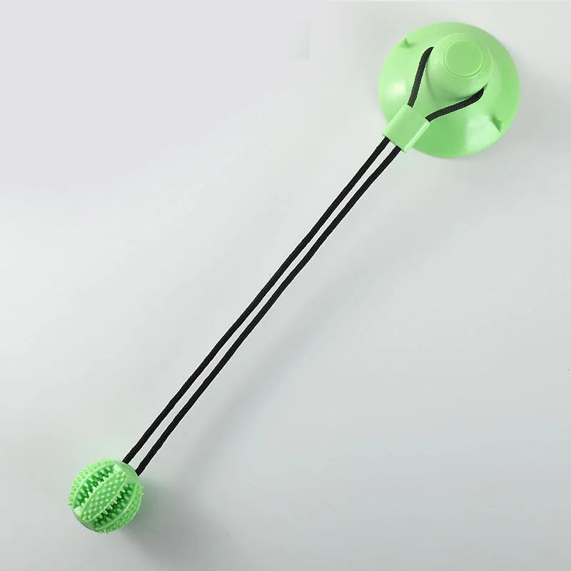 Rubber Treat Toy in Sage — full view of base, cords and ball on a white background