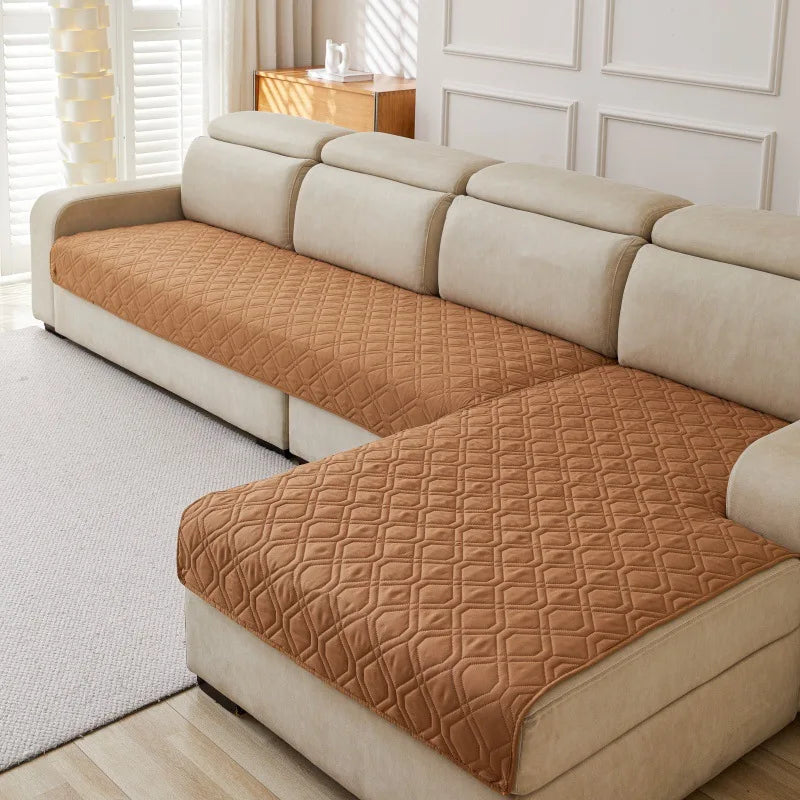 Quilted Sofa Protector in Cocoa — covering the seats of a cream sectional sofa