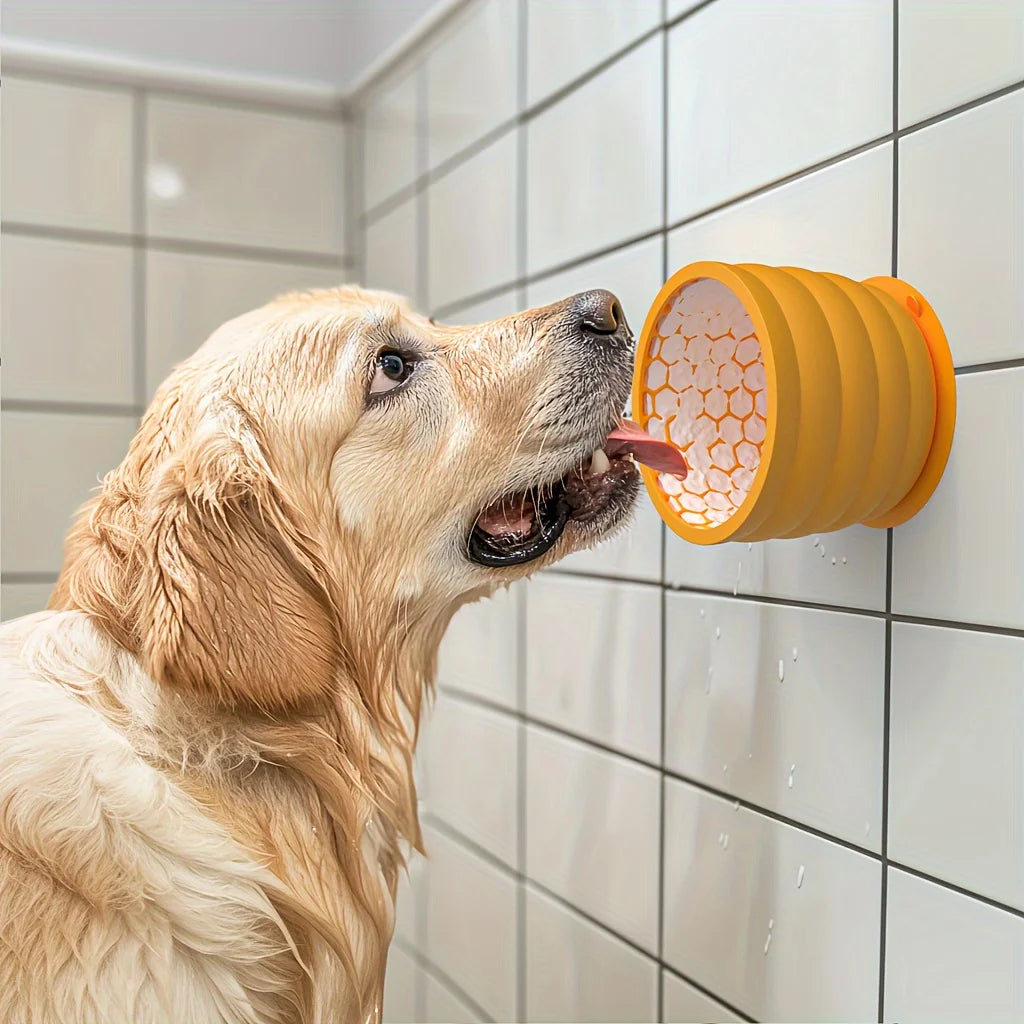 Silicone Slow Feeder in Mustard — dog licking the cup suctioned to a tiled wall