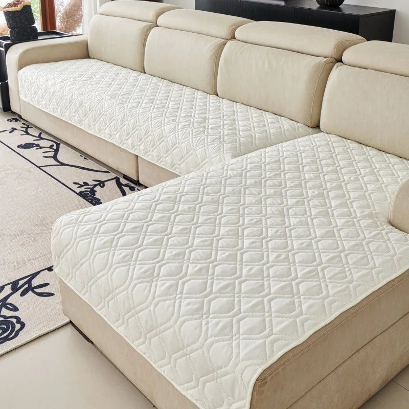 Quilted Sofa Protector in Cream — covering the seats of a cream sectional sofa