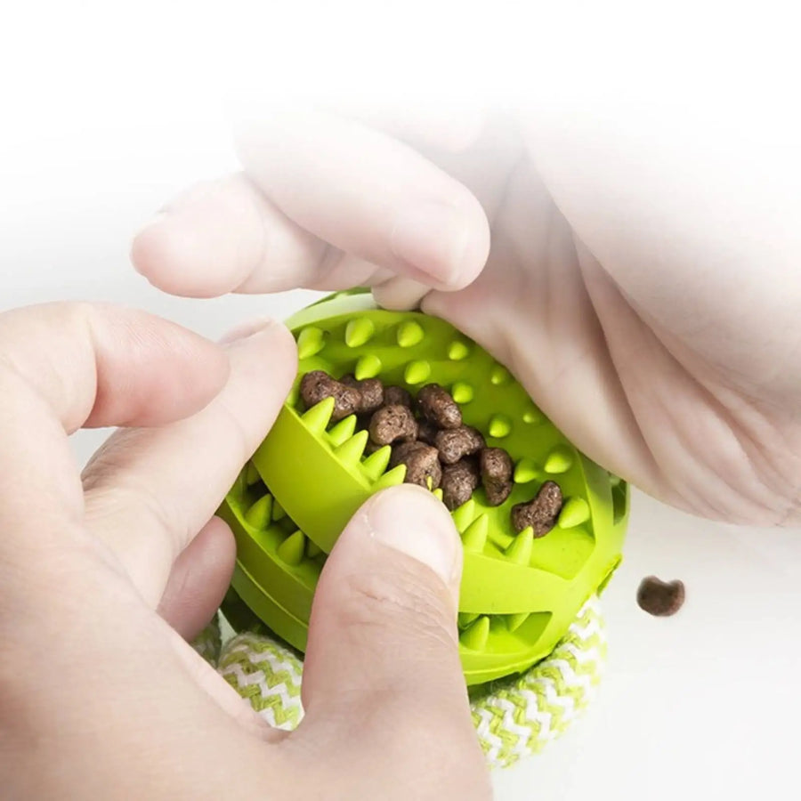 Rope Tug Toy in Sage — filling the treat ball with kibble