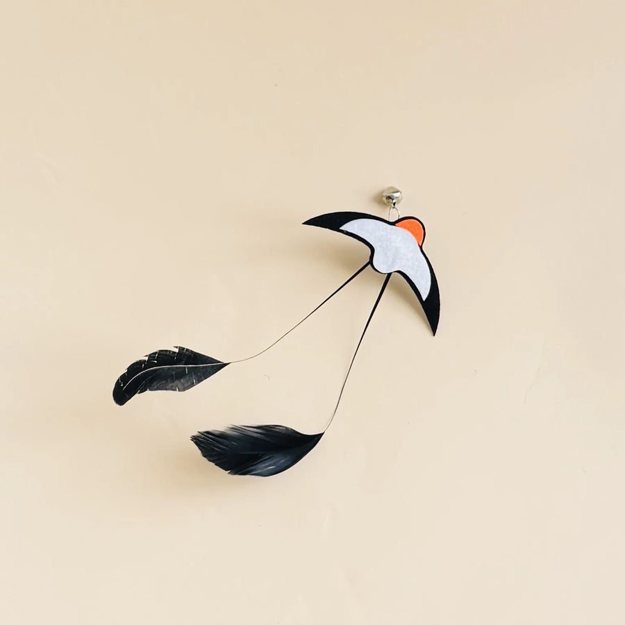Feather Wand Refills in Black — single refill on a warm sand background
