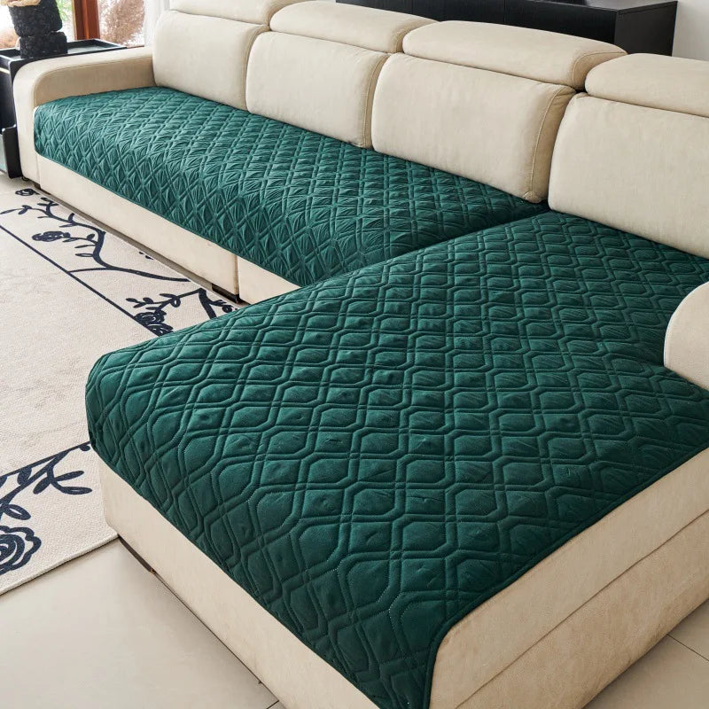 Quilted Sofa Protector in Forest — covering the seats of a cream sectional sofa