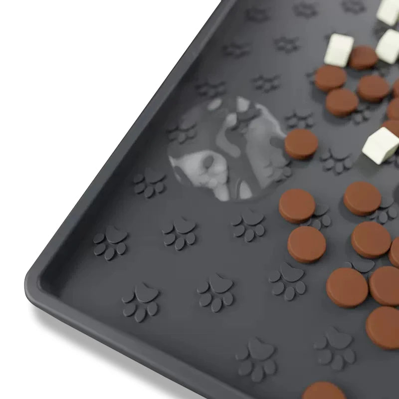 Silicone Feeding Mat in Stone — close-up of the raised edge and paw-print texture with treats