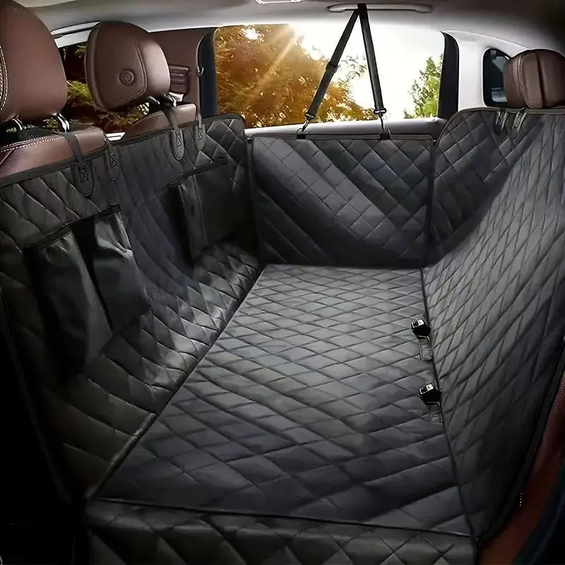 Back Seat Hammock in Black — quilted cover fitted across a car's rear seat with side door flaps