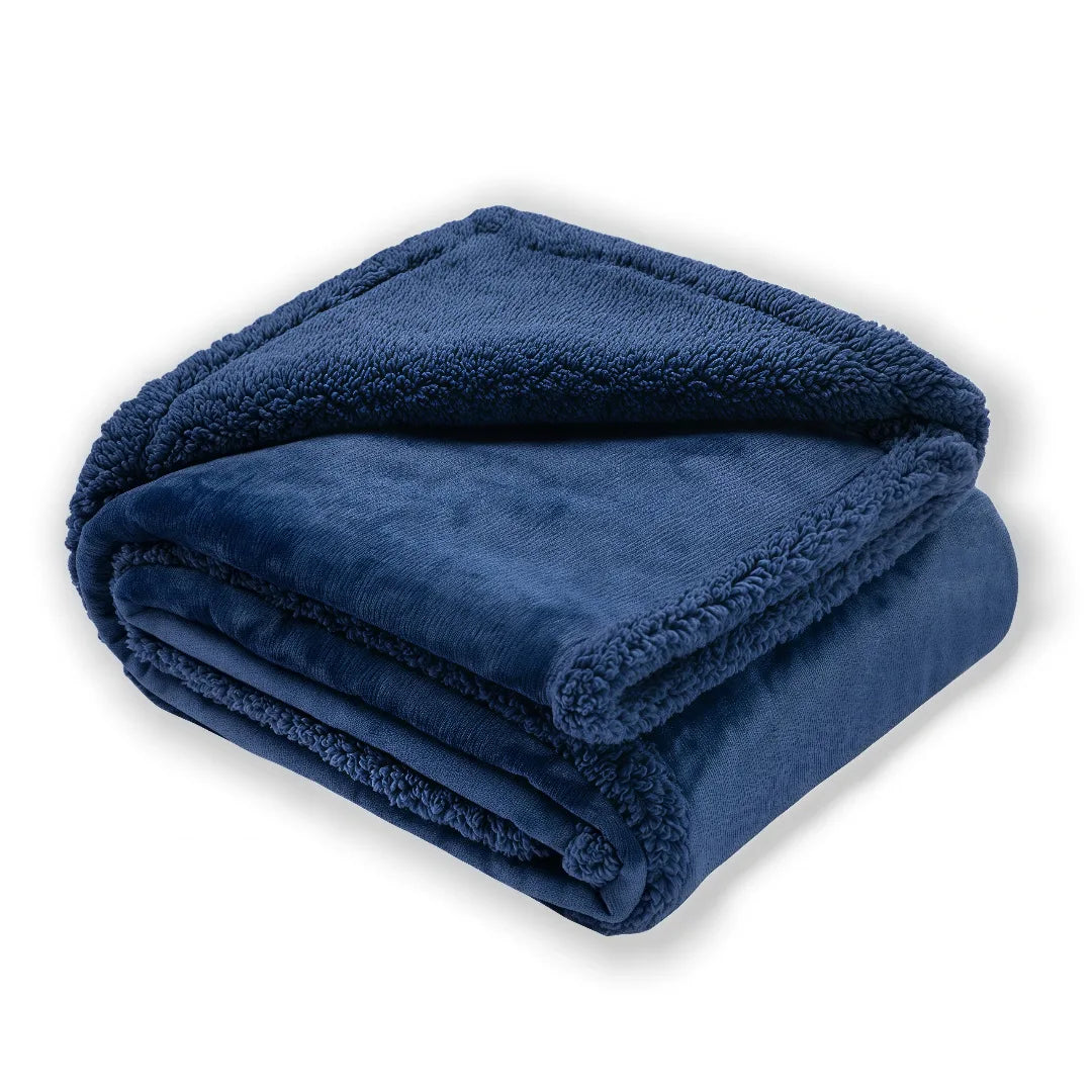 Reversible Sherpa Throw in Blue — folded to show the flannel and sherpa sides