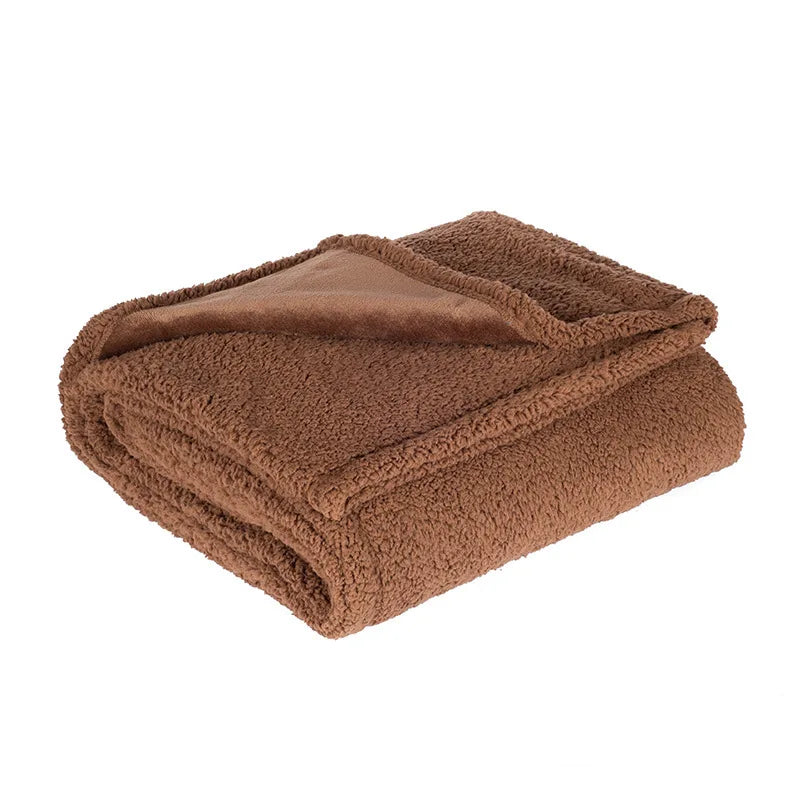 Reversible Sherpa Throw in Cocoa — folded to show the flannel and sherpa sides