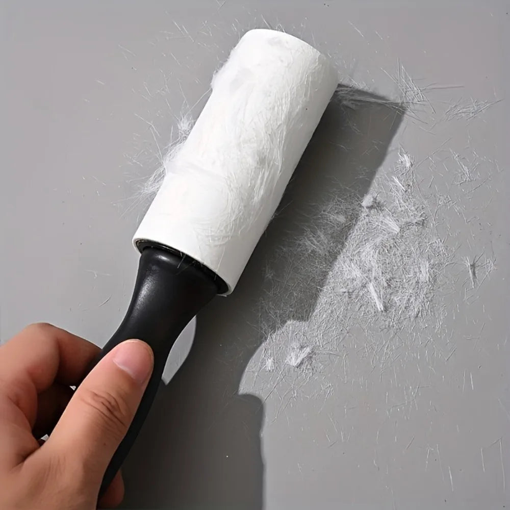 Pet Hair Lint Roller in Black — lifting loose hair from a grey surface