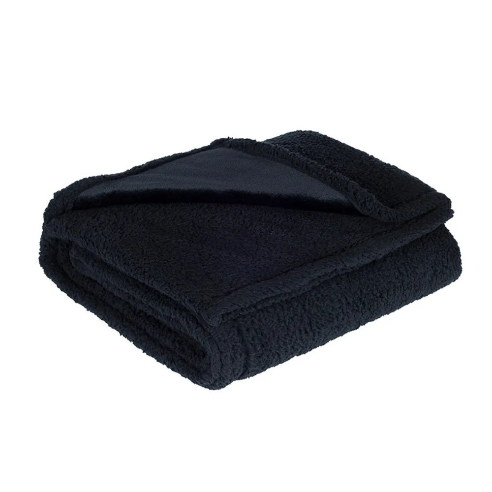 Reversible Sherpa Throw in Black — folded to show the flannel and sherpa sides