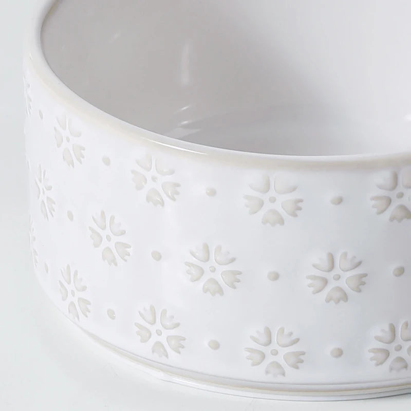 Raised Ceramic Feeder in Cream — close-up of the embossed floral glaze